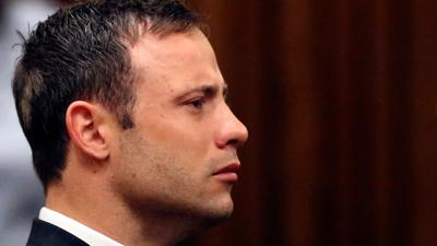 Oscar Pistorius looks straight ahead in court in Pretoria, South Africa, Friday, Sept. 12, 2014.  A South African judge on Friday found Oscar Pistorius guilty of culpable homicide, or negligent killing, in the shooting death of girlfriend Reeva Steenkam...