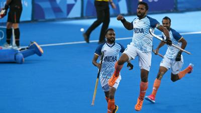 Harmanpreet Singh celebrates scoring his team's first goal in the men's semifinal field hockey match between Germany and India during the Paris Olympics at the Yves-du-Manoir Stadium in Colombes on August 6, 2024.